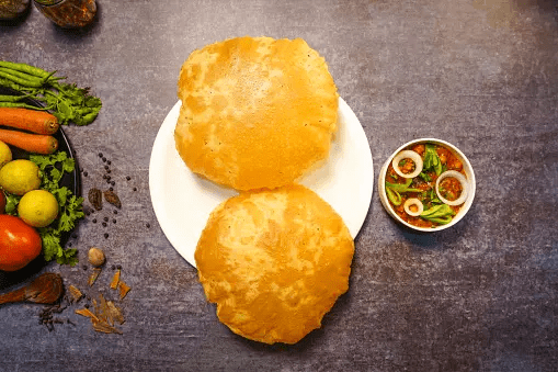 Culinary Bliss: Chhole Bhature – A Perfect Harmony of Spiced Chickpea Curry and Fried Bread